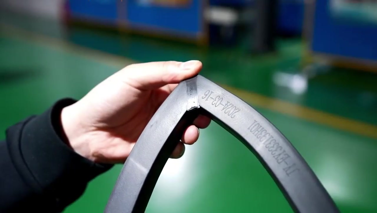 A molded component being checked in the SRRP factory film