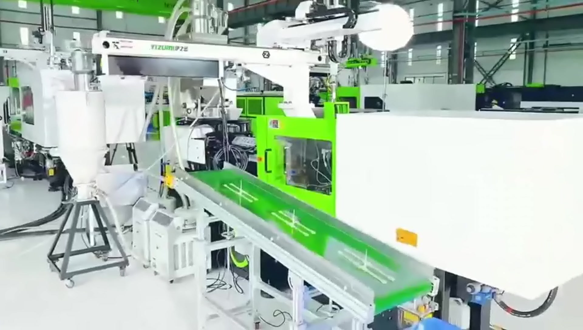 Customer-supplied company-film still showing an automated injection line