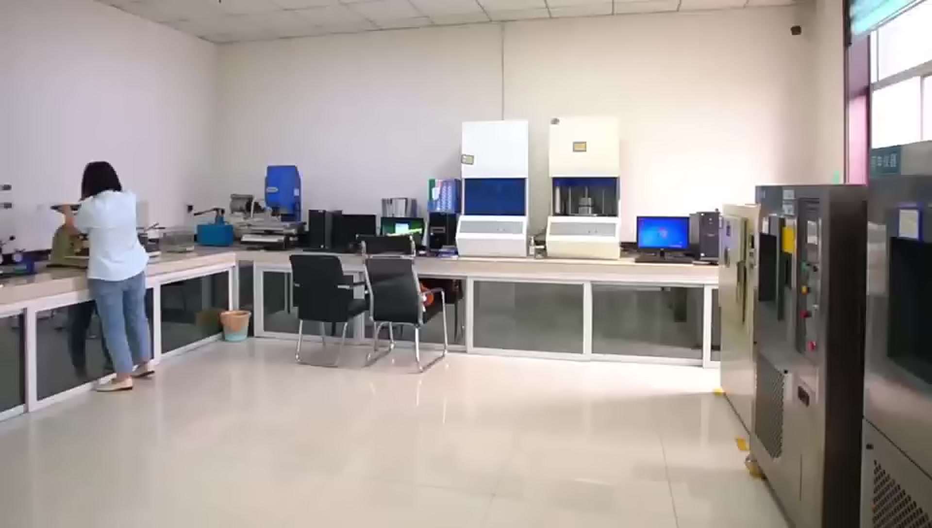 Customer-supplied company-film still showing the quality laboratory