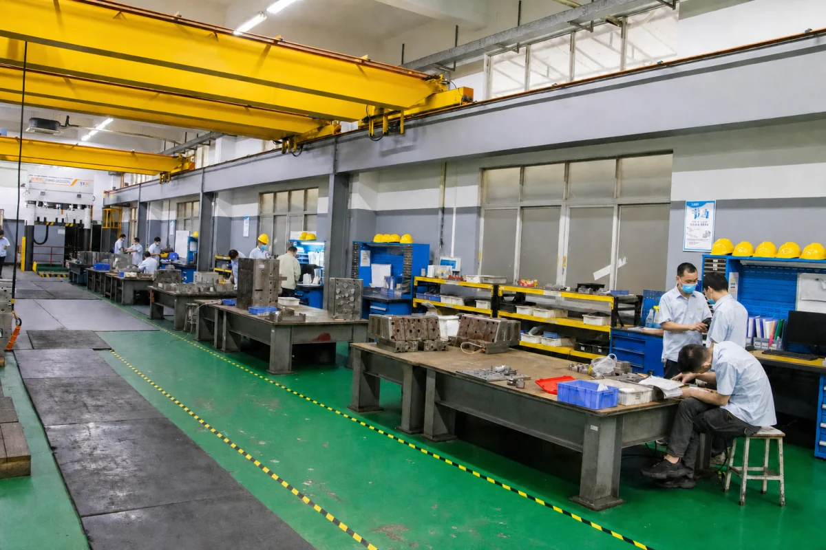 Moldmaking workshop with tooling staged for engineering review