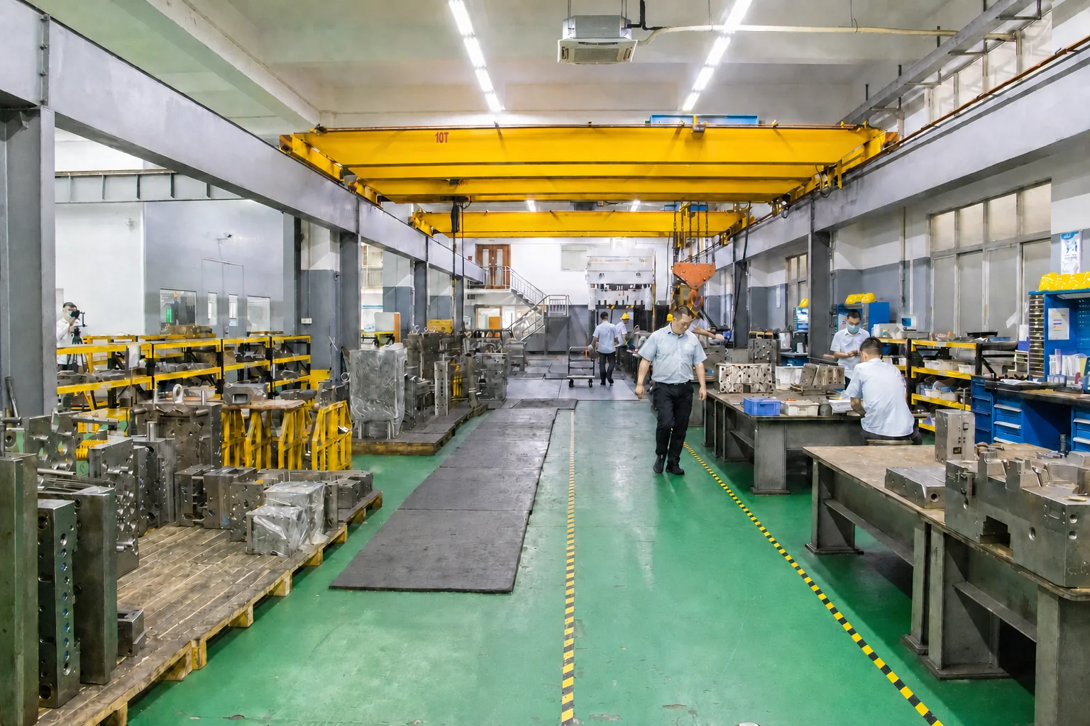 Moldmaking floor with molds staged at assembly and fitting benches