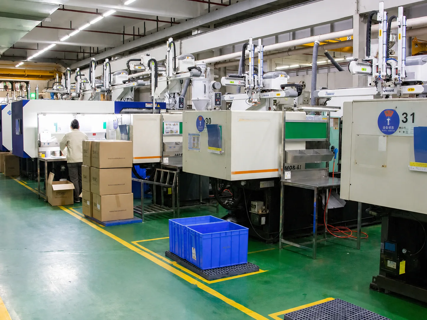 Injection molding line with take-out robots and organized part handling
